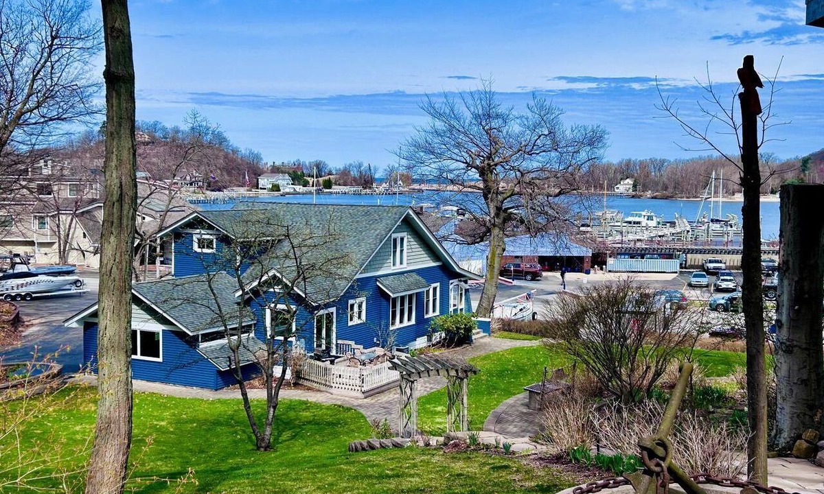 Macatawa Cottage | Charming Waterfront Cottage with Modern Remodel Overlooking Lake Macatawa Harbor, Near Macatawa, Michigan