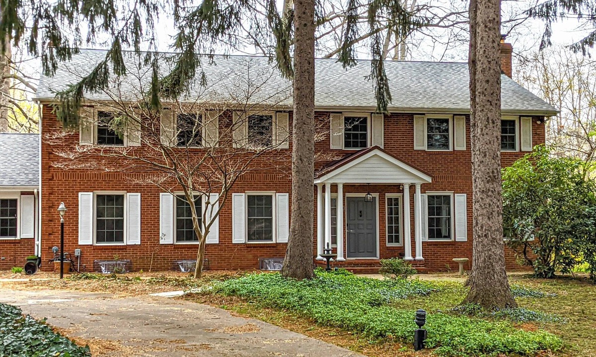 Stevensville House | Colonial style 5BR/5BA home tucked in a private, wooded setting w/pool & hot tub