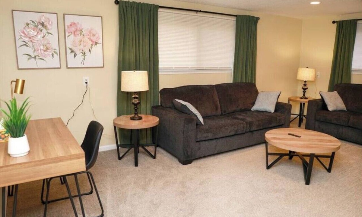 Commerce Township House | Cozy spacious 4-bedroom home nestled in wooded lot with enclosed porch