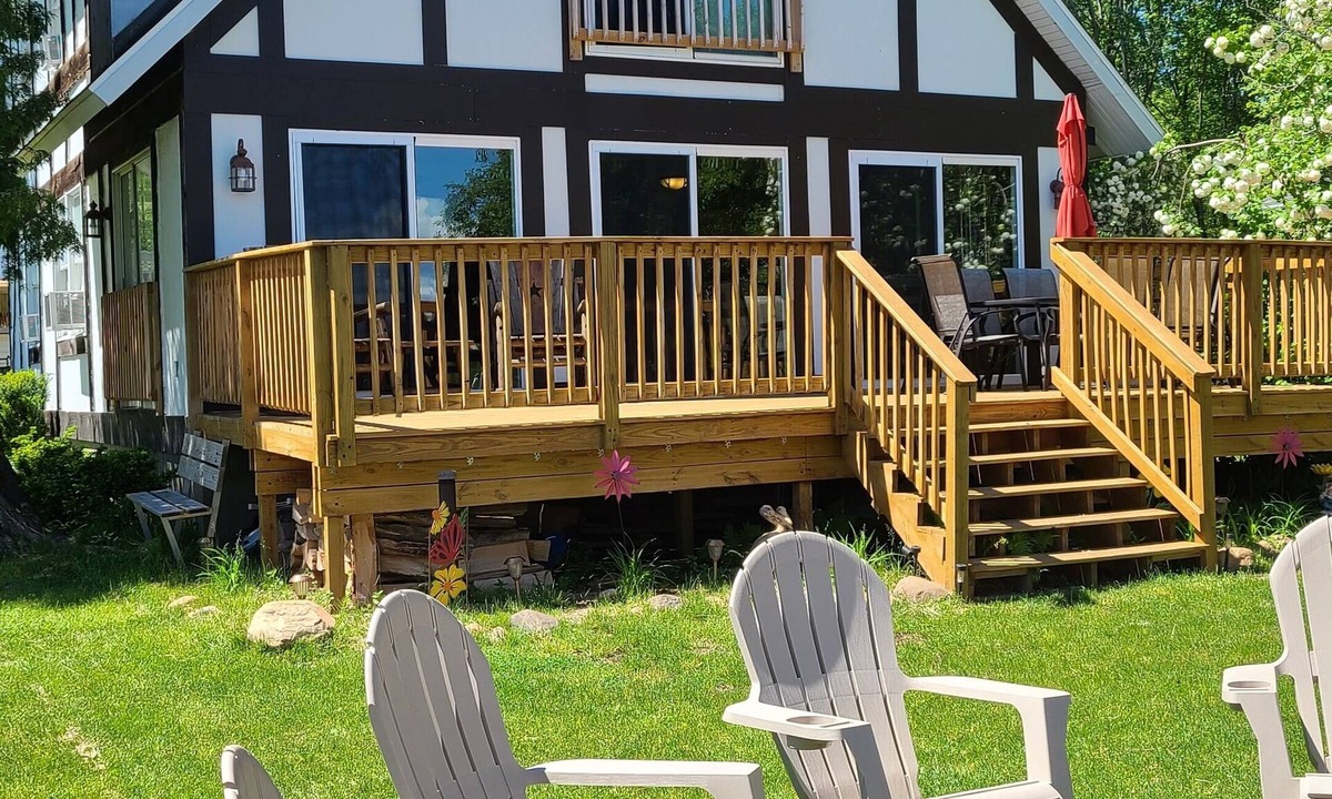 Sister Lakes House | Family Friendly Lakefront Whimsical Cottage with Pontoon Boat in Sister Lakes MI