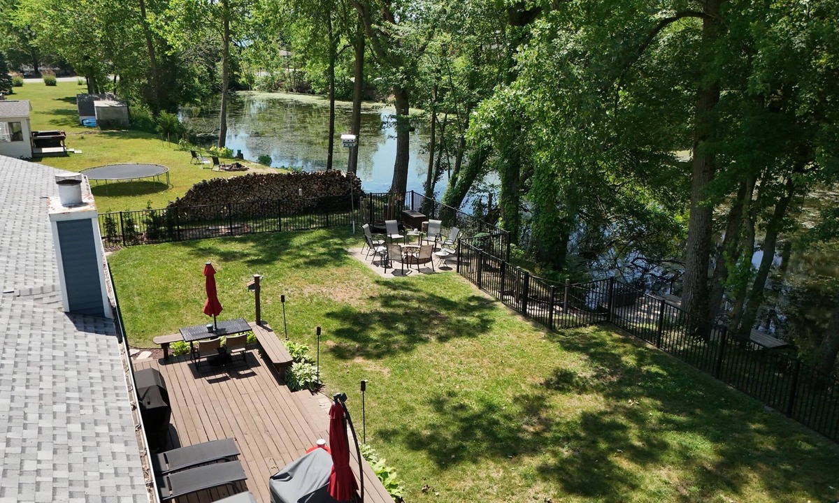 Paw Paw Lake House | Private lagoon retreat with walkable Paw Paw Lake access. Offers a peaceful setting with water views, fishing, and outdoor space to relax. Close to wineries, Lake Michigan beaches, and local attractions—perfect for family and group getaways.