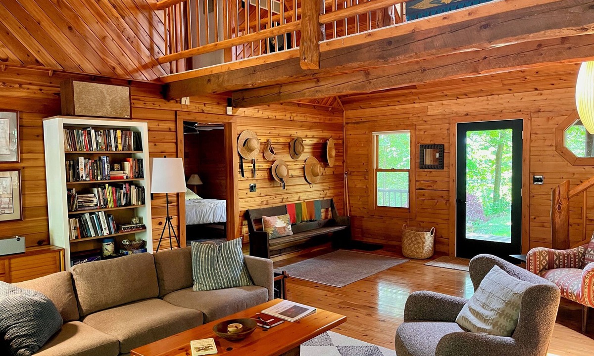 West Olive Cottage | Upscale 4-bedroom, 3 full bathroom lakeside log cabin in West Olive, Michigan.