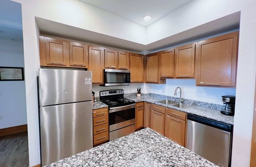 Grandville Apartment | 2BR Suite at The Grand Castle Pool, Gym & Parking