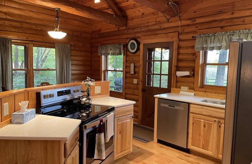 Lawrence Cabin | Beautiful log cabin with all the creature comforts of home. Private fishing lake
