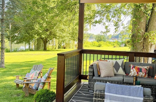 Dowling House | Bungalow on the water offers a canoe, paddle boards, paddle boat, fishing gear.