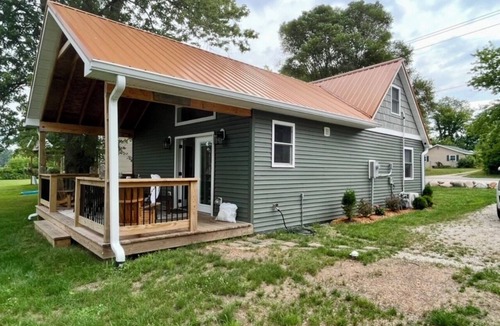 Dowling House | Bungalow on the water offers a canoe, paddle boards, paddle boat, fishing gear.