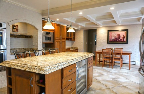 Stevensville House | Colonial style 5BR/5BA home tucked in a private, wooded setting w/pool & hot tub