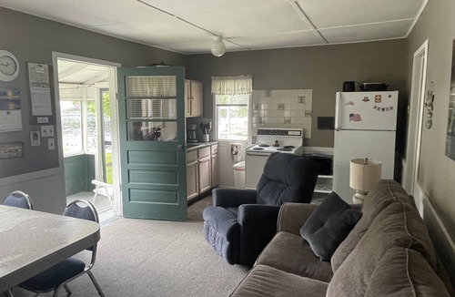 Ludington Cottage | Cottage 2 is a 2 bedroom 25’ from its boat dock & Hamlin Lake