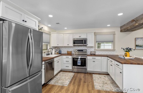 Greenville Cottage | Cottage on the Lake w/pontoon! SUP boards, kayaks, hot tub, fire pit & fishing!