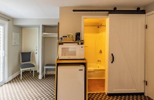 Whitehall Resort | Great room with two Full beds. Lake view from deck