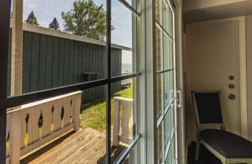 Whitehall Resort | Great room with two Full beds. Lake view from deck