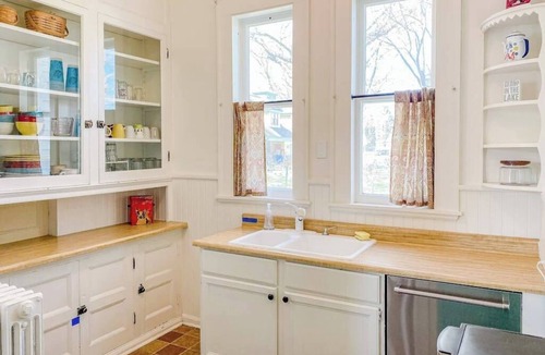 Manistee House | Historical dog-friendly home with fenced yard, grill, Ping-Pong, fireplace, & AC