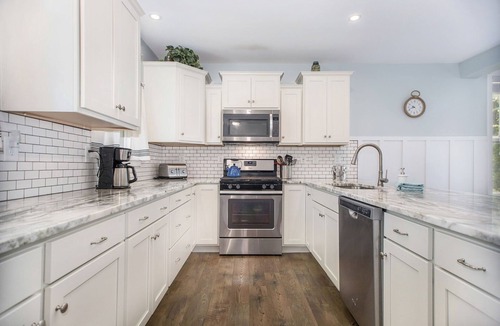 Miami Park House | Hot tub, EV friendly, main floor primary suite with plenty of space.