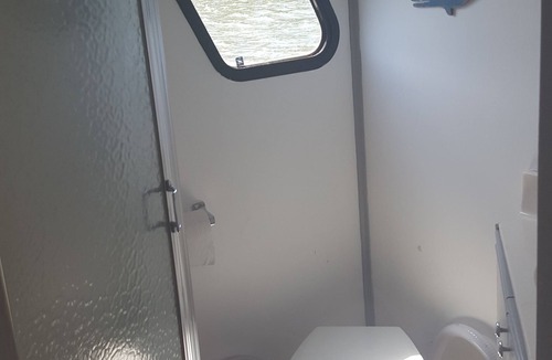 Coopersville Boat Rental | Houseboat on Grand River on private wooded lot