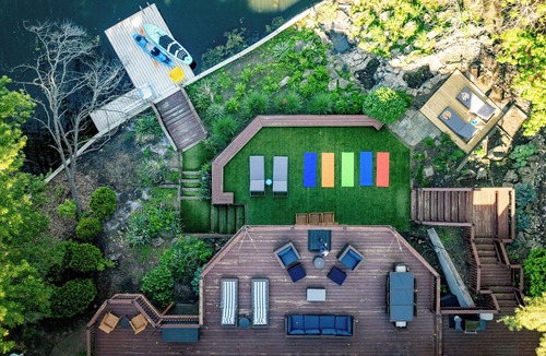 Pimento House | Luxury Lakefront Retreat w/Indoor Pool, Arcade, Outdoor TV, Hot Tub + Kayaks