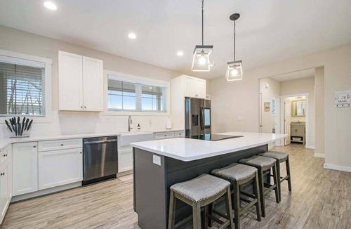 Sawyer House | Modern home with large sun-room, firepit, grill, washer/dryer, & central AC