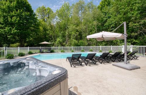 South Haven House | Pool, Hot Tub & Screened Porch - Fireplace Overlooking Wooded Ravine