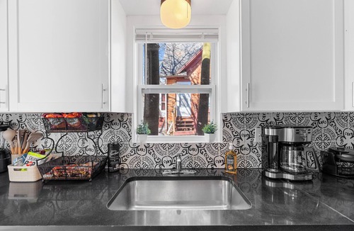 Lansing House | Spacious 4-bedrooms with 3 full showers, comfortable living room and dining