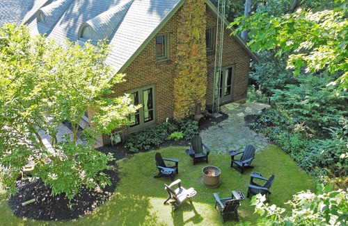 Fair Plain House | Spacious group getaway with heated pool, sauna, basketball court, and firepit. Sleeps up to 15 guests and is just minutes from Lake Michigan beaches and downtown St. Joseph. Perfect for family vacations, group trips, and relaxing Southwest Michigan.