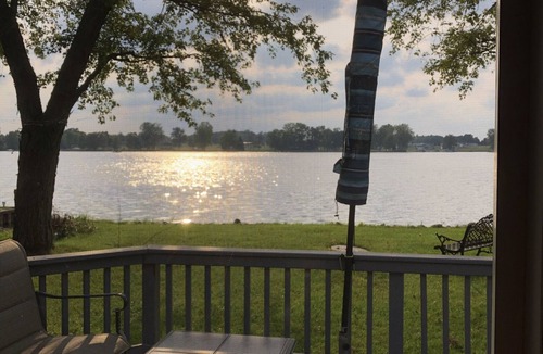 Coldwater Cottage | Spectacular sunset views and north chain lake front red cottage rental