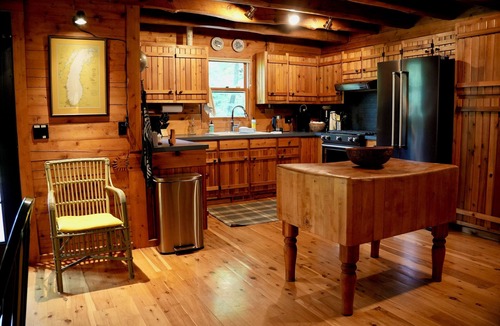 West Olive Cottage | Upscale 4-bedroom, 3 full bathroom lakeside log cabin in West Olive, Michigan.