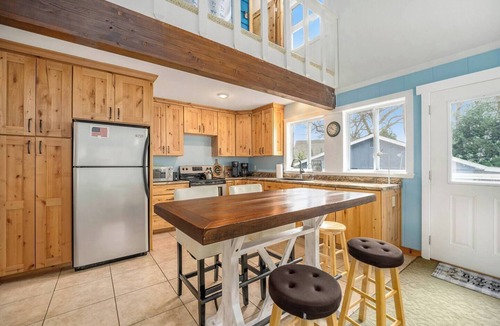 Kendall House | Wake up to peaceful lake views, launch a kayak from the dock, and unwind by the firepit at sunset. This quiet Gravel Lake retreat offers private waterfront, space to relax, and everything you need for an easy lakeside escape.