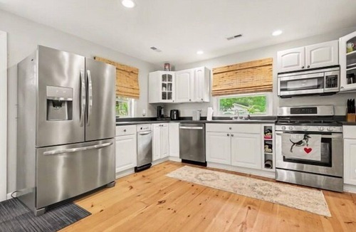 Michigan City House | Welcome to Lake Breeze Cottage near Lake Michigan! This 2-bedroom, 2-bath home offers a king and queen bedroom, sofa couch, open-concept living space, and a private back patio for guest enjoyment.