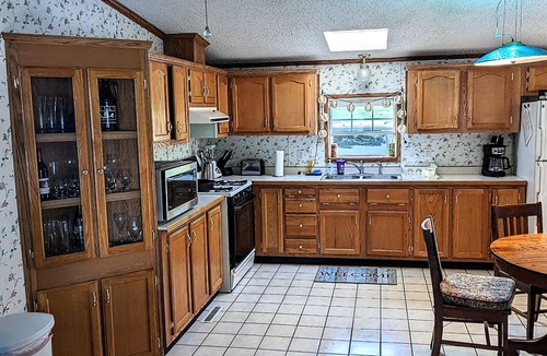 Coloma House | You'll love sipping a drink on the deck while enjoying views of Paw Paw Lake.