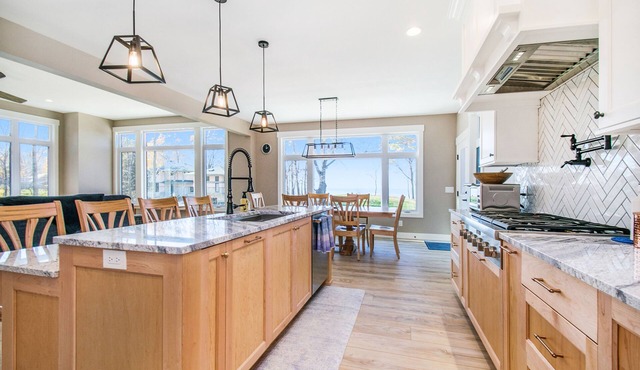 Enchanting lakefront home with pool, hot tub, firepit, game room, & washer/dryer