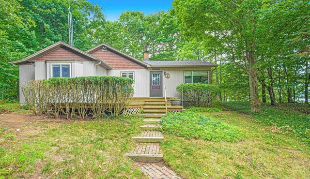 Inviting dog-friendly home with Lake Michigan views & charming sunroom