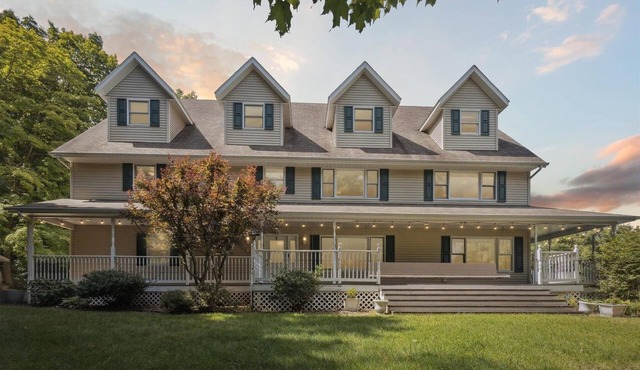 Peaceful Gathering Place with 12 bedrooms and 7 bathrooms. Game Tables and Pool!