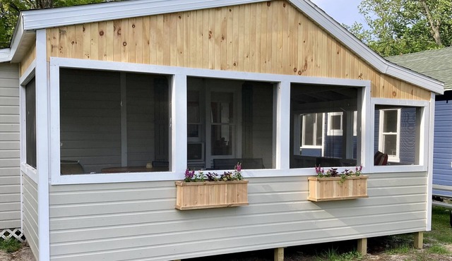 Remodeled lakefront cottage w/marina, firepit, swimming area.