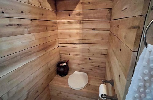 Kent County Cabin | Beautiful cedar treehouse that has wall-to-wall windows, forest and river view!