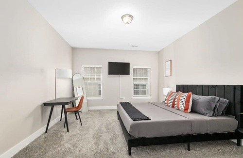 Grandville Apartment | Modern 4BR 4BA Two Unit Condo w Garage and Patio